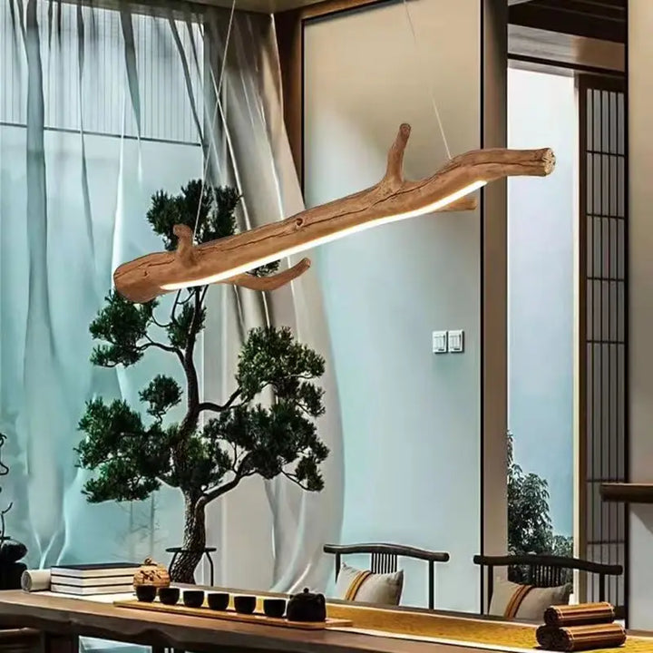 Suspension bois branche design bohème avec LED intégrées, créant une atmosphère chaleureuse et accueillante. Parfait pour un style bohème ou éco-chic. Idéal pour salon, cuisine, salle à manger.
